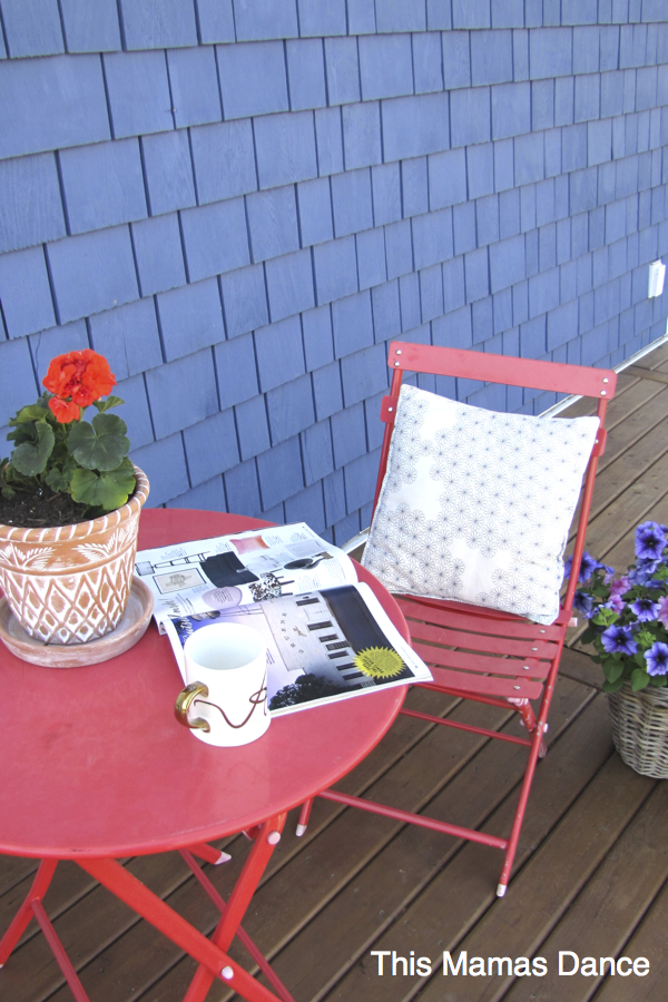 Cute red bistro set looks great against the blue house kellyelko.com