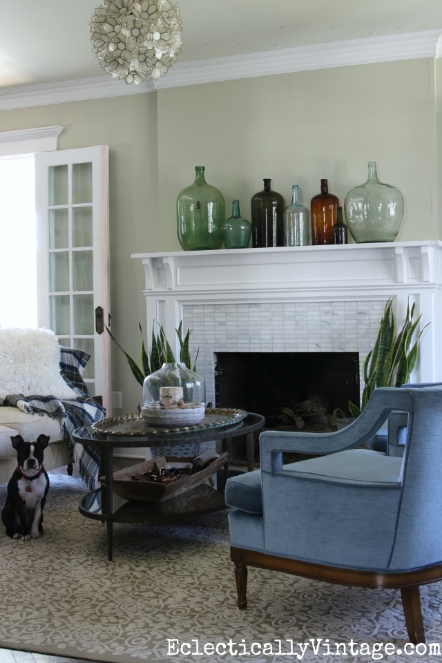 Love the vintage demijohn collection on the mantel kellyelko.com