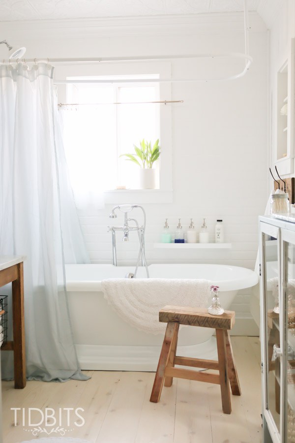 Cottage bathroom - love the freestanding bathtub and rustic wood stool kellyelko.com