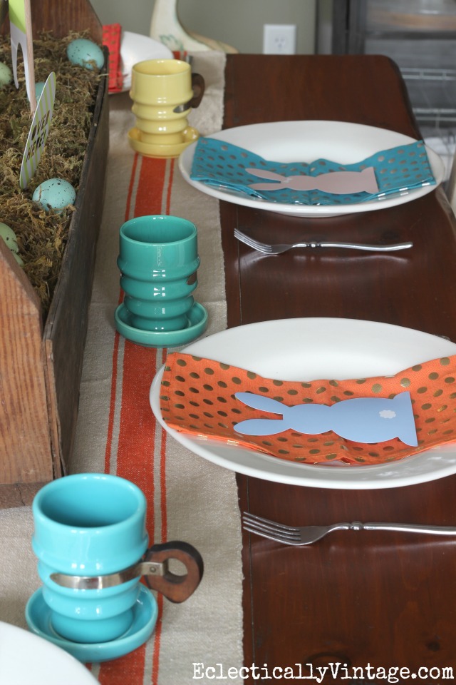 Easter table - love the colorful vintage mugs and napkins kellyelko.com