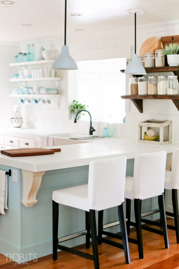 Cottage kitchen with lots of character from rustic wood shelves and planked walls kellyelko.com