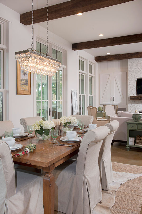 Farmhouse dining room with parsons chairs and crystal chandelier kellyelko.com