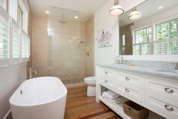 Love this white master bathroom with double marble vanity and freestanding tub kellyelko.com