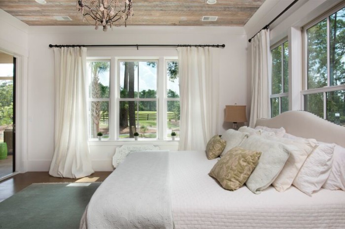 Love the reclaimed barn wood ceiling in this coastal master bedroom kellyelko.com