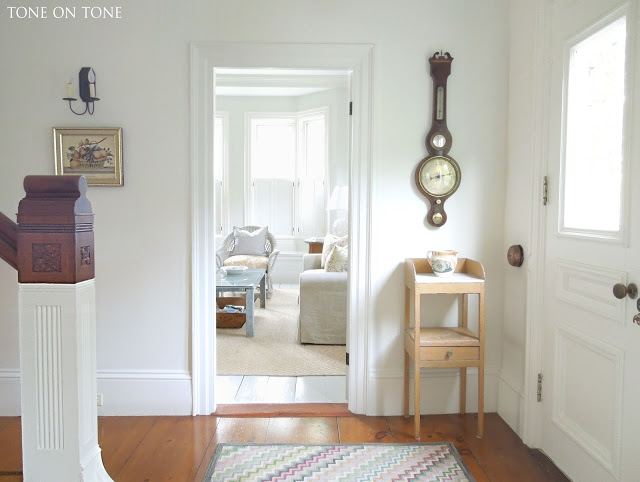 Neutral white entry with beautiful antique pine floors kellyelko.com