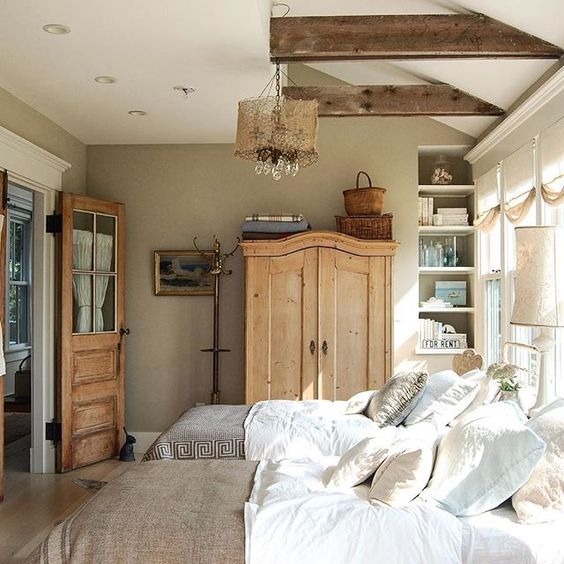 Charming neutral guest bedroom - love the wood ceiling beams kellyelko.com