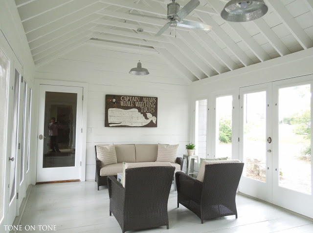 Beautiful breezeway makes the perfect sunroom - love the exposed beams and the galvanized ceiling fan kellyelko.com