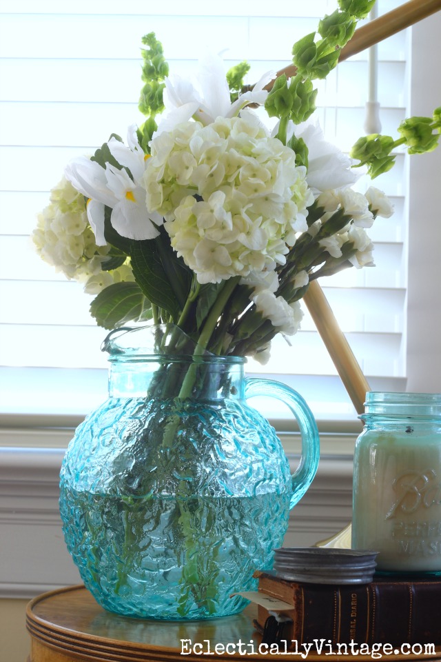 Gorgeous white flower arrangement in a vintage blue pitcher kellyelko.com