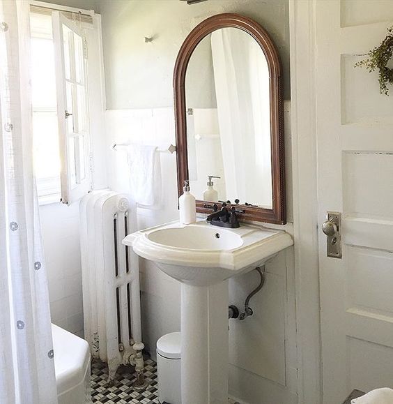 Love this antique bathroom and the original window that swings in kellyelko.com