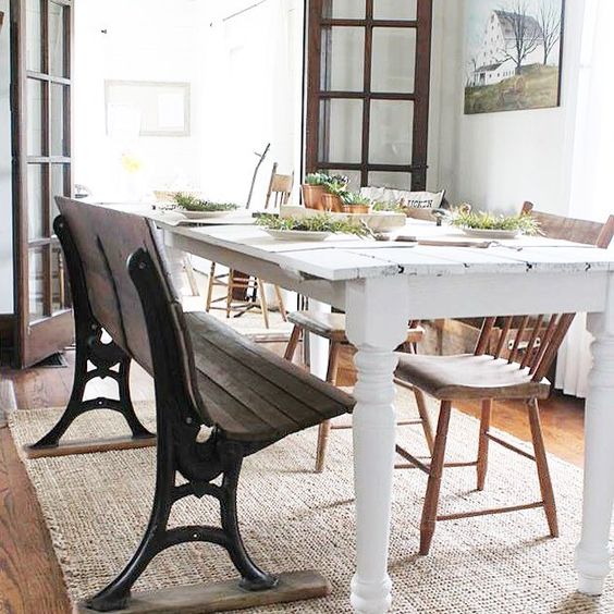 An antique bench is a fun addition to this farmhouse dining room kellyelko.com