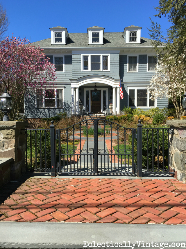 Curb Appeal - love this black iron gate and the charming path kellyelko.com