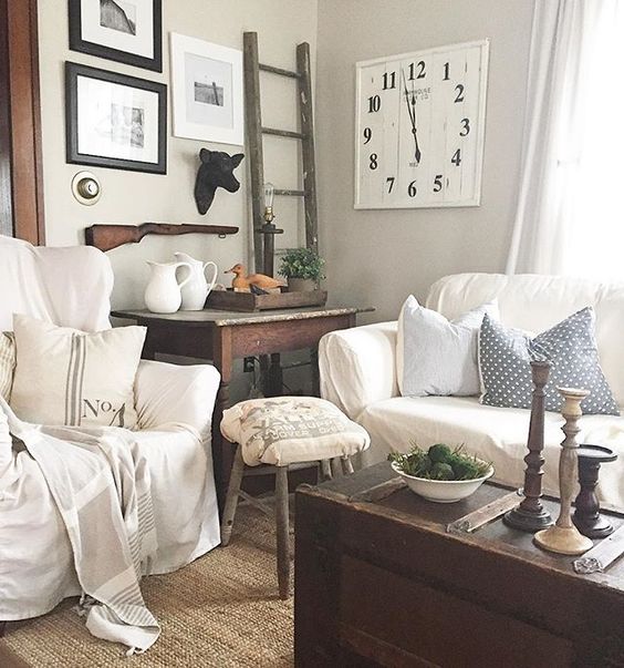 Cozy family room - love the white slipcovered furniture and the rustic trunk coffee table kellyelko.com