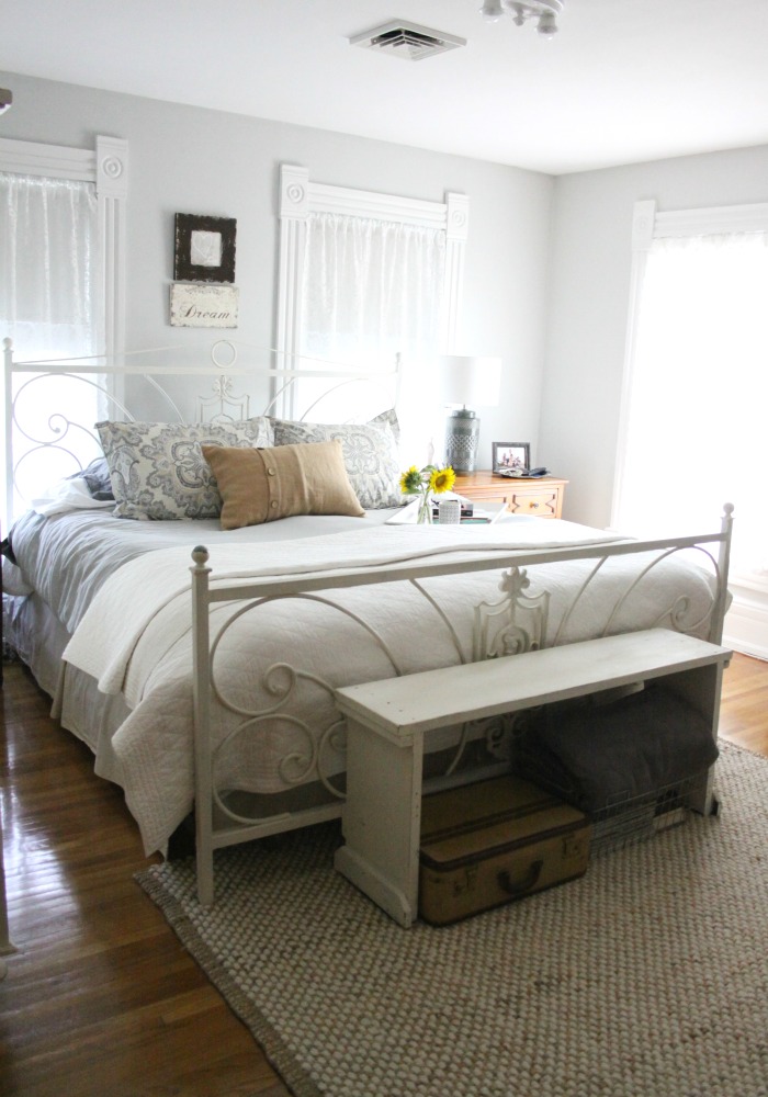 Cozy gray bedroom - love the rustic bench at the foot of the bed kellyelko.com