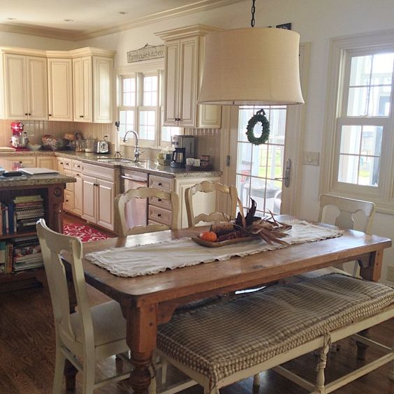 Farmhouse kitchen table and mismatched chairs with bench kellyelko.com