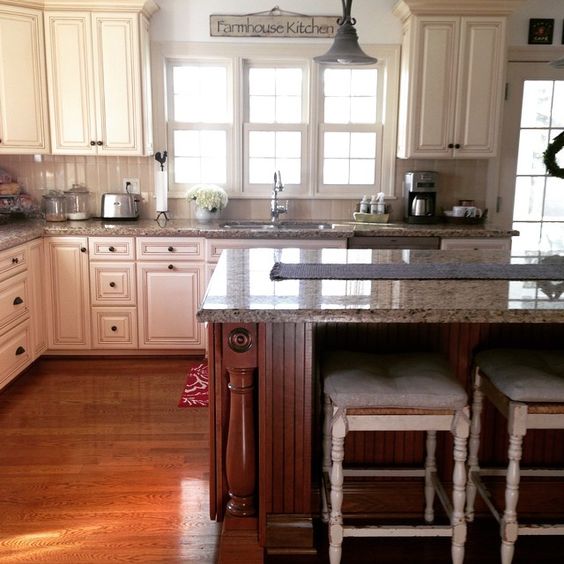 Farmhouse kitchen - love the white cabinets and natural wood island kellyelko.com