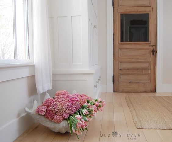 Giant clam shell planter - so beautiful overflowing with pink hydrangeas and tulips kellyelko.com