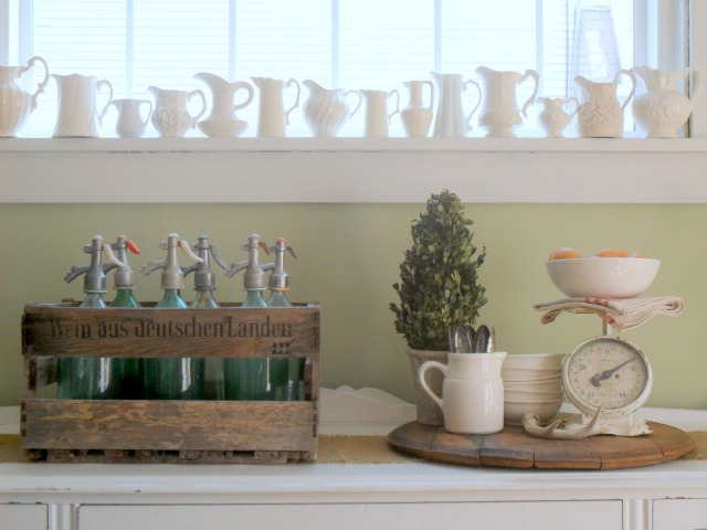 Love this ironstone pitcher collection lined up on a windowsill! kellyelko.com