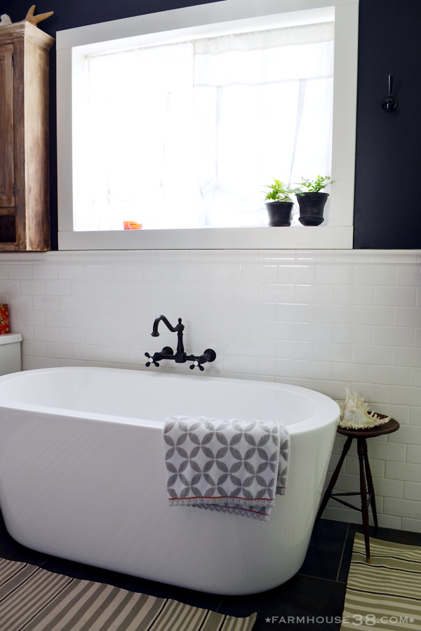 Modern bathtub - love the bold wall color kellyelko.com