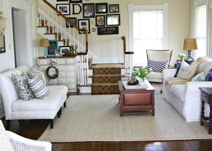 Love this neutral living room and the staircase gallery wall kellyelko.com