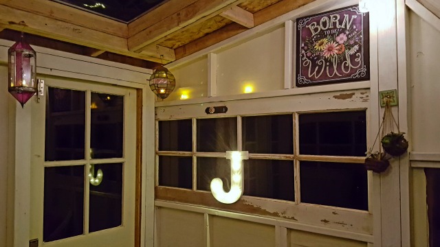 Old door used as a window in this very cool upcycled treehouse