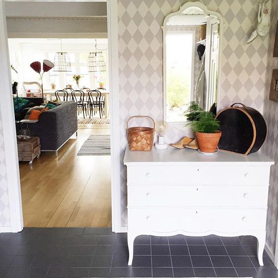 Love the painted harlequin wall in this foyer kellyelko.com