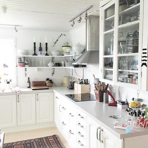 Love the open shelving combined with glass front cabinets in this functional kitchen kellyelko.com