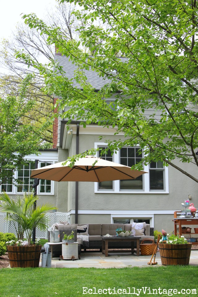 Love this beautiful bluestone patio with sectional sofa and beautiful container plantings kellyelko.com