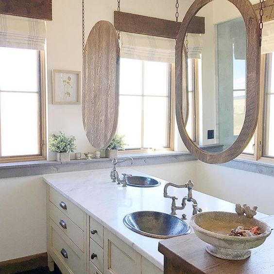 Great idea to hang bathroom mirrors from the ceiling when short on wall space kellyelko.com