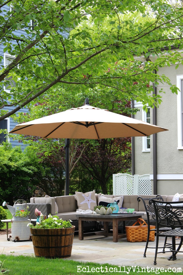 Love this patio - the huge sectional sofa and concrete coffee table make it feel like an indoor room kellyelko.com