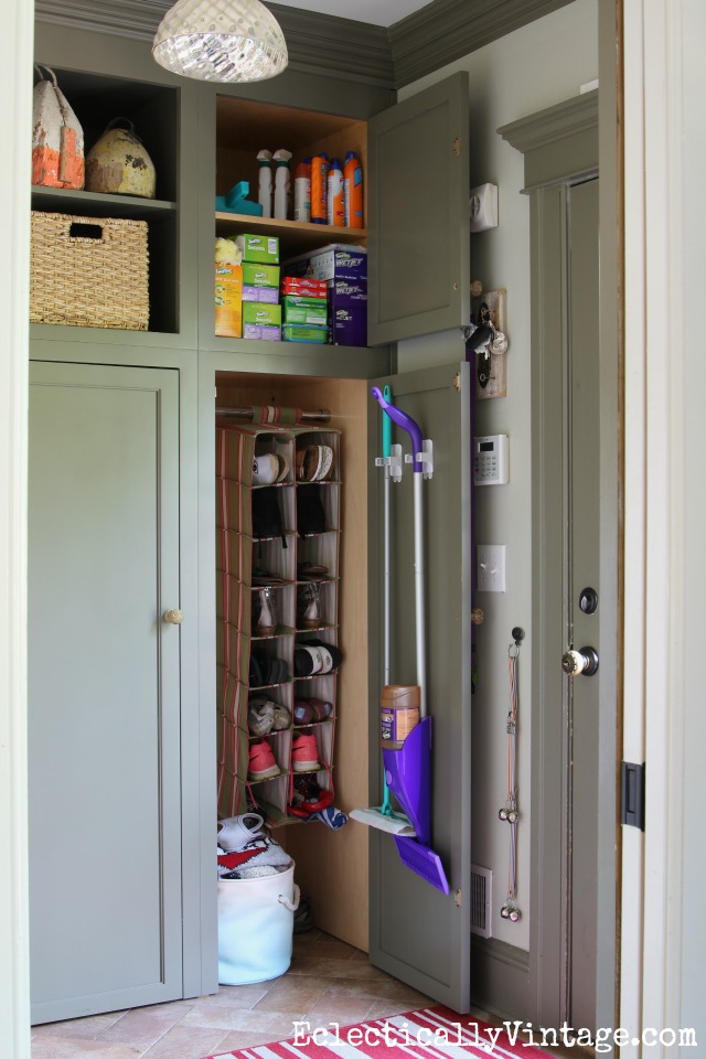 Cleaning Supply Closet - everything in one easy to reach place and I love the broom grippers for holding mops on inside of doors kellyelko.com