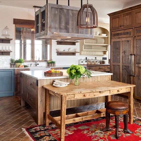 Love the natural wood in this farmhouse kitchen and the rustic farm table kellyelko.com