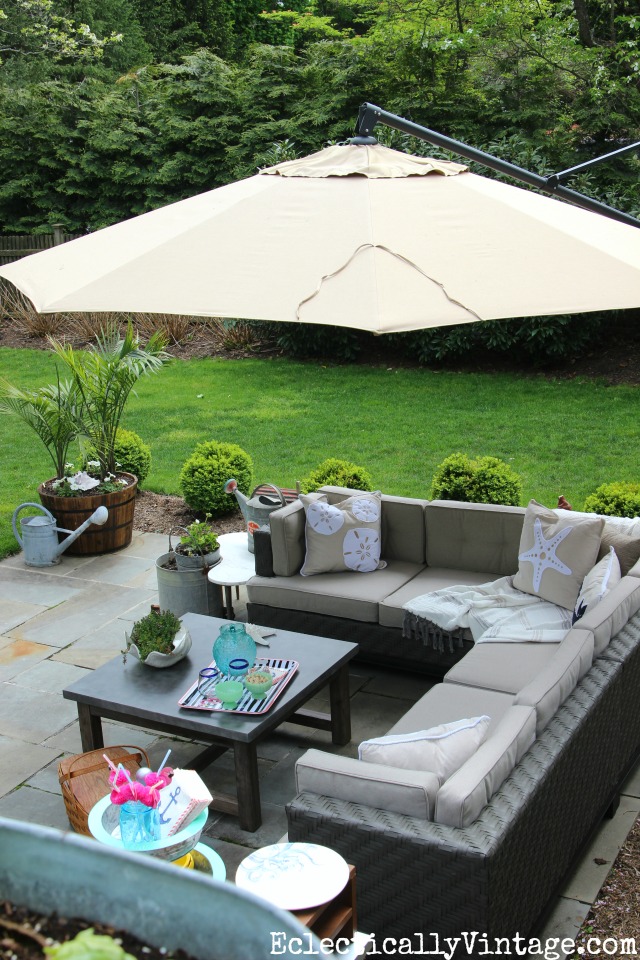 Love this outdoor sectional sofa with cantilevered umbrella kellyelko.com