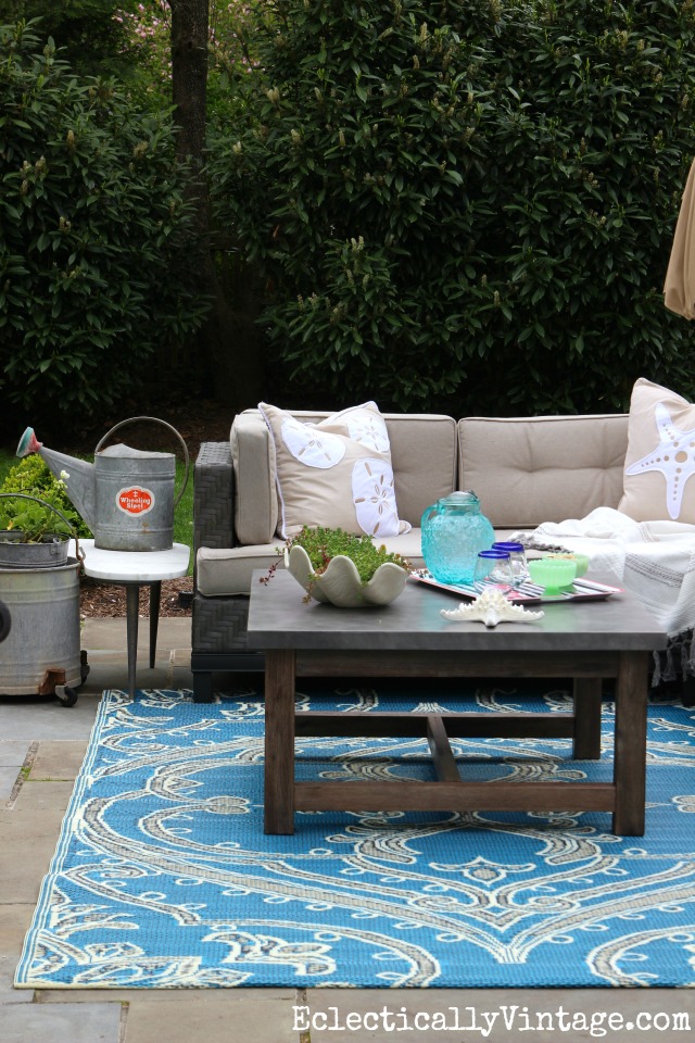 Add an outdoor rug to add a fun pop of color to the patio kellyelko.com