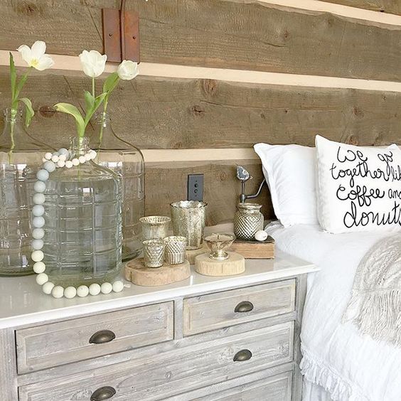 Love the rustic wood walls in this farmhouse bedroom kellyelko.com