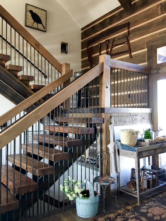 Love the rustic wood walls in this farmhouse foyer kellyelko.com