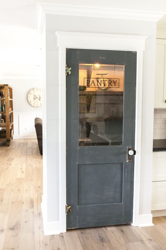 Use an old door to add character to a new home - love this pantry door kellyelko.com