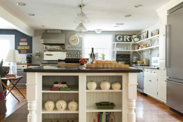 White farmhouse kitchen - love the open shelves and all the vintage signs kellyelko.com