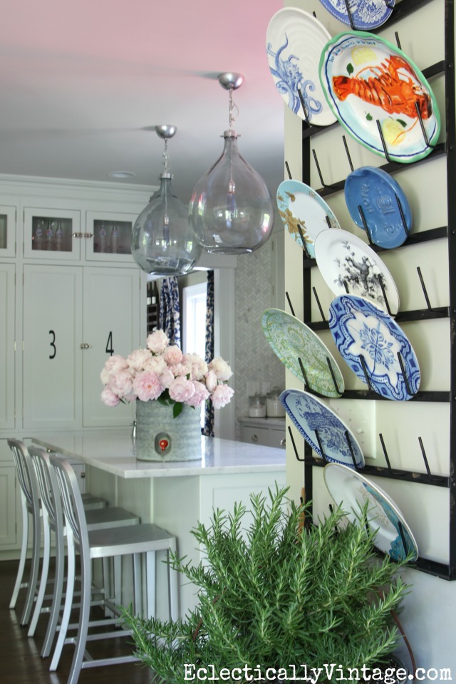 Love this gorgeous kitchen and her plate collection displayed on a glass drying rack kellyelko.com