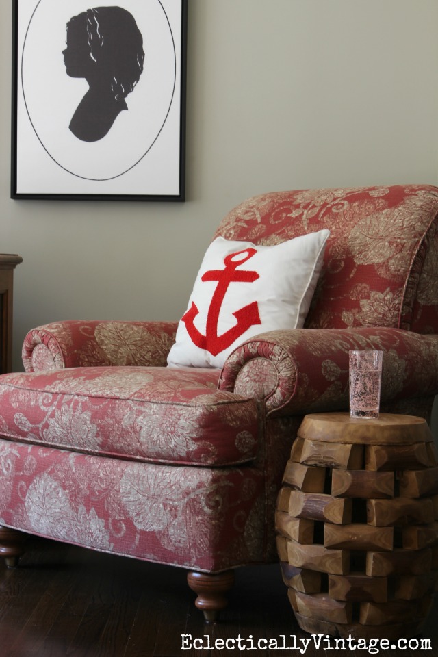 Cozy reading nook - love the anchor pillow and carved wood table kellyelko.com
