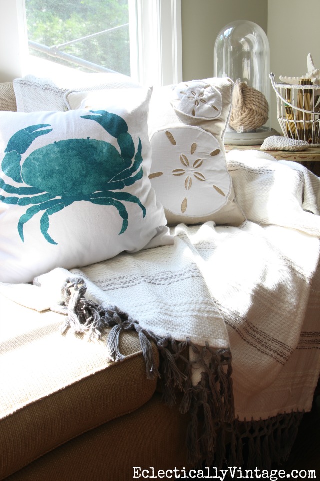 Love the neutral pillows and throw with the fun blue crab pillow kellyelko.com