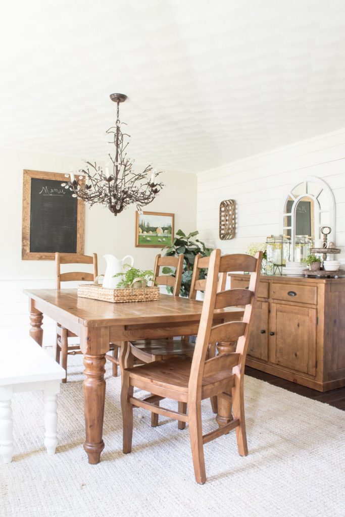 Farmhouse dining room with DIY planked walls kellyelko.com