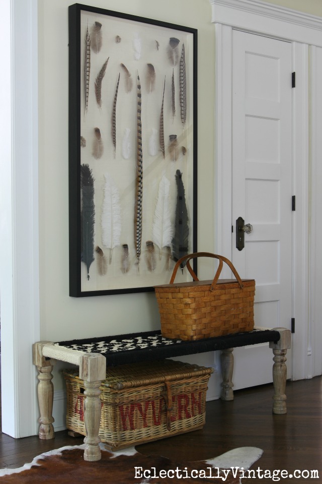 Love this giant shadowbox of feathers and the woven bench and baskets in this foyer kellyelko.com