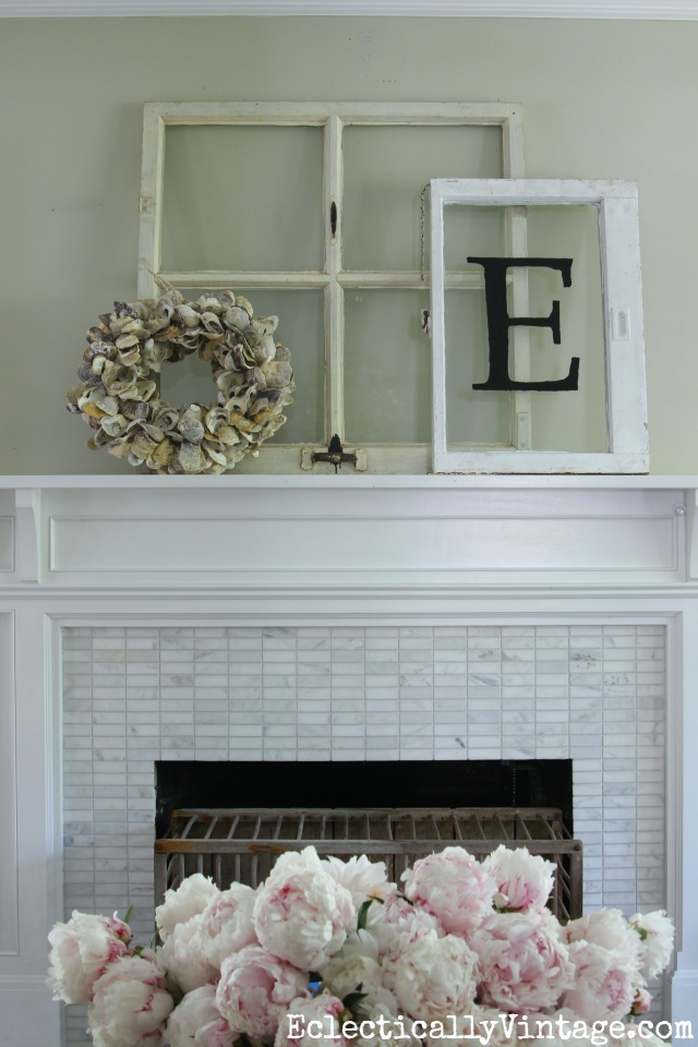 Love this summer mantel with vintage windows and an oyster shell wreath kellyelko.com