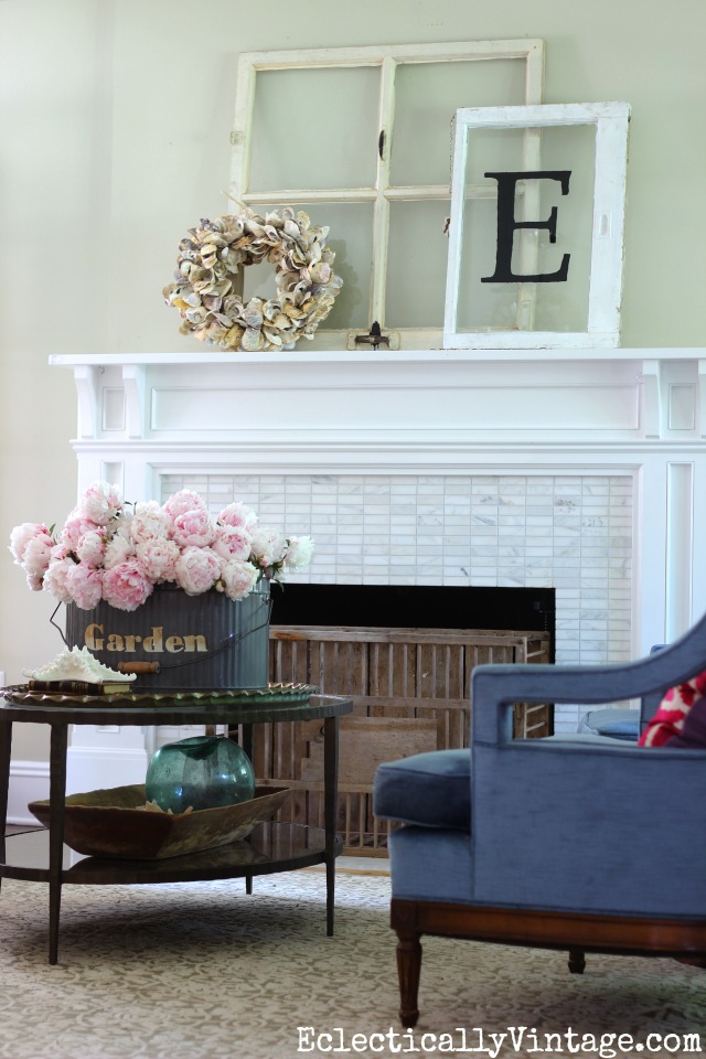 Summer mantel - love the old windows with oyster shell wreath and the huge bouquet of peonies! kellyelko.com