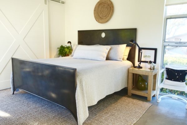 Love this black metal bed and the sliding barn door kellyelko.com