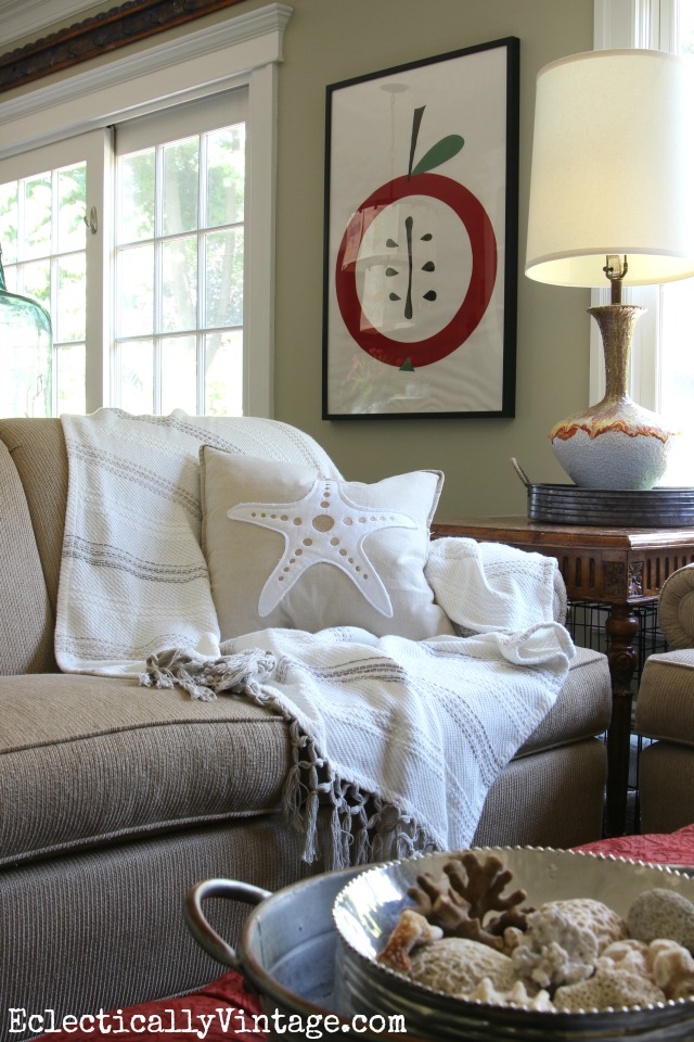 Love this cozy family room and that fun apple art! kellyelko.com