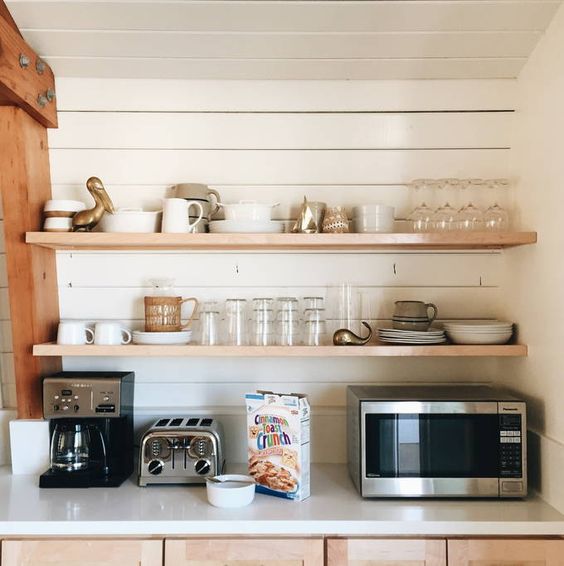 Love the floating shelves on the shiplap walls in this kitchen kellyelko.com