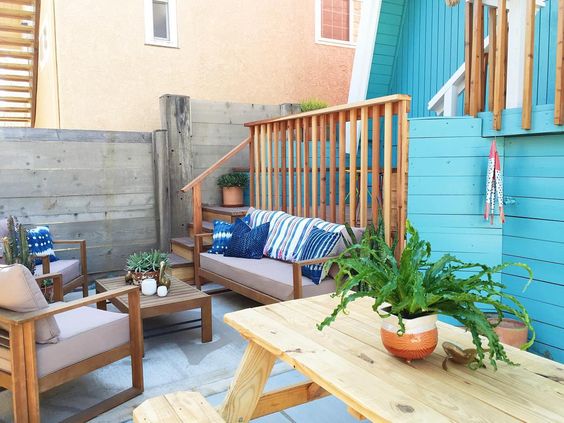 Small beach house patio - love the colorful blue house kellyelko.com