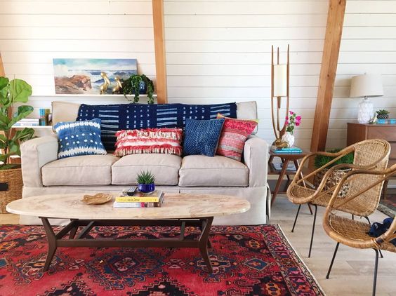 Love the colorful vintage textiles and rug in this mid century beach house kellyelko.com