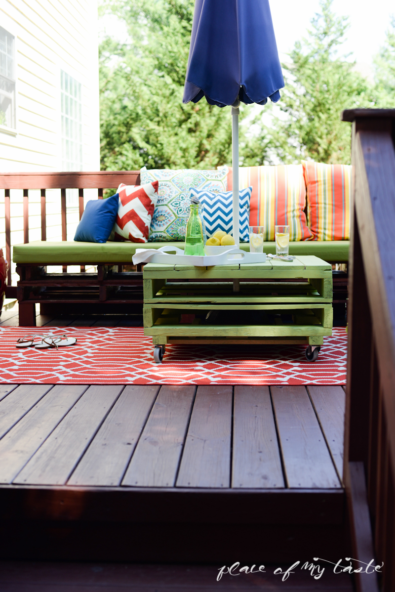 DIY pallet coffee table and colorful deck kellyelko.com